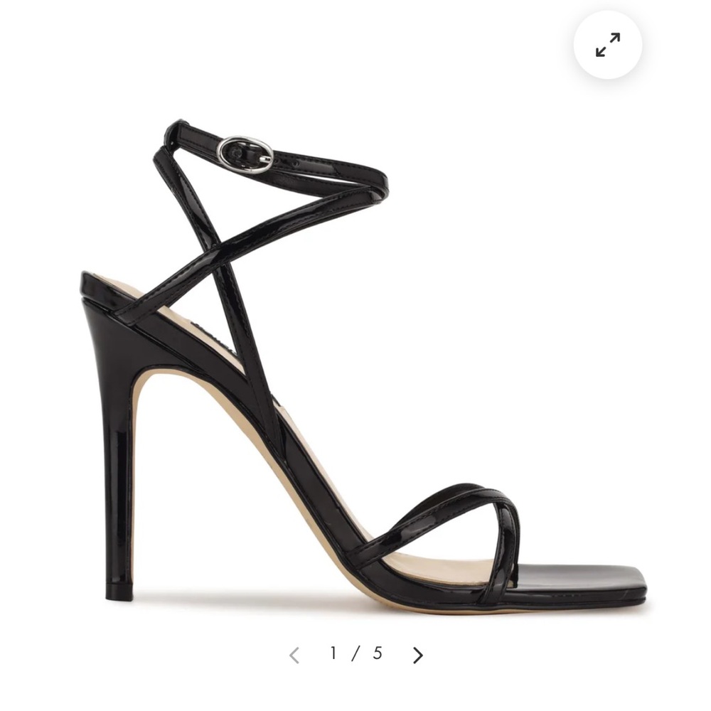 Cute and sexy black strappy high heeled sandal.  Size 5 1/2.